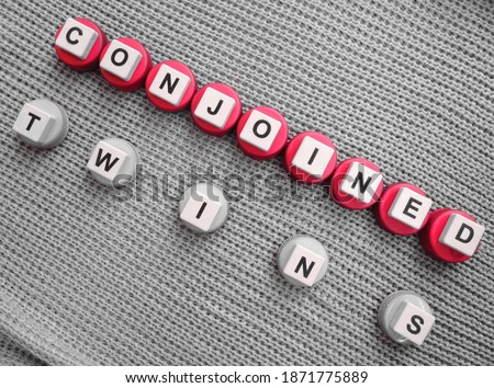 Conjoined Twins, word cube with background.