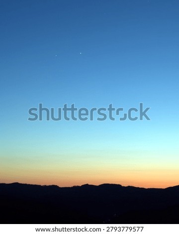 The conjunction of the planets Venus and Jupiter high in the mountains.