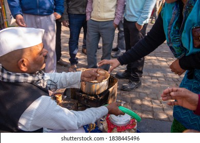 Connaught place, Delhi/India- January 10 2017: Indian tea seller using Kulhad for serving Masala tea in Connaught place 