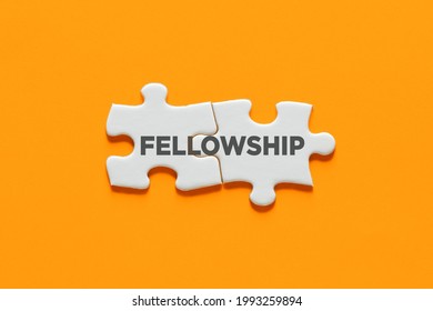 Connected puzzle pieces with the word fellowship. Cooperation, partnership, solidarity and support in business concept.