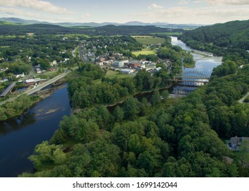 The Connecticut River flows south from the villages of Woodsville, NH and Wells River, VT, after growing from the influx of the Ammonoosuc and Wells rivers descending into the valley.
