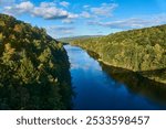 The Connecticut river going through a valley in early fall. 