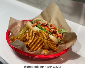 A Connecticut Style Lobster Roll With French Fries