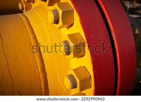 Connecting bolts of the flange connection of the main gas pipeline, close-up, color picture