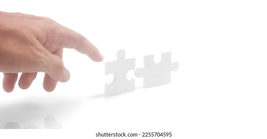 Connecting jigsaw puzzle. Business solutions success and strategy concept - Shutterstock ID 2255704595