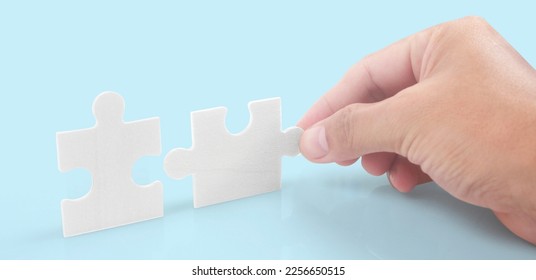 Connecting jigsaw puzzle. Business solutions success and strategy concept - Shutterstock ID 2256650515