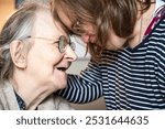 Connecting moment between 86 yo mother and 42 yo daughter with Down Syndrome in Tienen, Flemish Brabant, Belgium