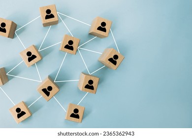 Connecting people, partnership, social media networks concept on blue background using wooden blocks. Digital communication, teamwork, network and community concept.