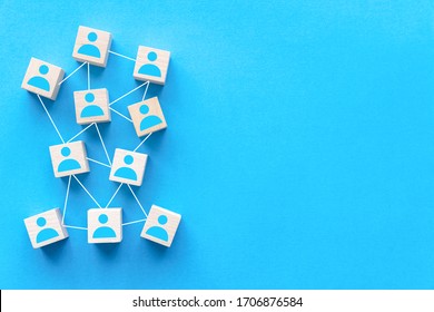 Connecting people or social media networking concept using wood square block on blue background