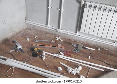 Connecting plastic pipe. Installing water heating radiator