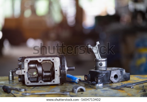 connecting rod and piston of air\
compressor pump, Mechanical maintenance and repair\
background