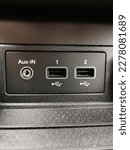 Connection for aux-in jack cable and two USB ports.