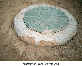 Connection To Central Street Water Supply And Sewerage Networks. Sewer Hatch On A Plot Of Land. Sewer Well. Horizontal Photo.