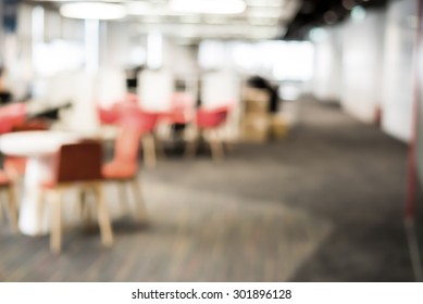 The Connection Zone. Abstract Blur Business Office Working Space Background With Modern Interior Table And Chair With Devices. Blurry Creative Workplace Design Background