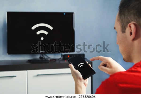 connectivity between smart tv and smart phone\
through wifi connection. Control your TV with your smartphone. The\
wifi icon on the phone screen and the\
monitor