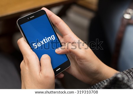 connectivity and security concept: girl using a digital generated phone with sexting on the screen. All screen graphics are made up.
