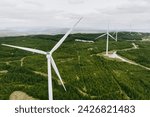 Connemara aerial landscape with wind turbines of Galway Wind Park located in Cloosh Valley, County Galway. Largest onshore wind farm in Ireland, green energy generation. Galway Wind Way recreation.