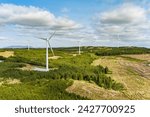 Connemara aerial landscape with wind turbines of Galway Wind Park located in Cloosh Valley, County Galway. Largest onshore wind farm in Ireland, green energy generation. Galway Wind Way recreation.