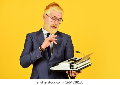 Connoisseur Of Vintage Values. Vintage Typewriter. Businessman Use Retro Technology. Mature Man Dyed Beard Hair Yellow Background. Writer Stick Old Habits. Used Goods Store. Salesman Vintage Objects.