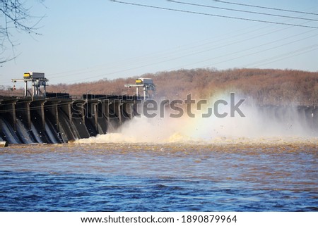 The Conowingo dam releases water and the mist reflects a rainbow