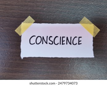 Conscience writting on table background.
