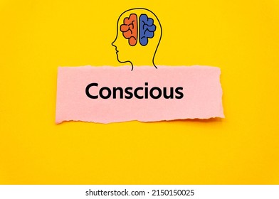 Conscious.The word is written on a slip of colored paper. Psychological terms, psychologic words, Spiritual terminology. psychiatric research. Mental Health Buzzwords.