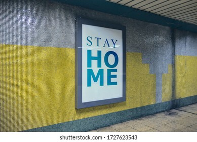 Consciousness Raising Billboard With The Message Of Stay Home Request To Make People Stay Safe From Coronavirus Placed On A Wall At Subway Corridors