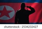 Conscript doing saluting hand gesture towards North Korea flag in command center, showing respect. Military unit in uniform serving in Korean Peoples Army, doing honoring gesturing, camera B