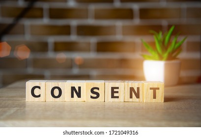 Consent - Word From Wooden Blocks With Letters, Sexual Education Age Of Consent Concept, Top View On Brick Background.