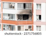 Consequences after the fire. A burnt-out balcony in a residential building.