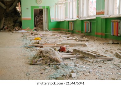 Consequences of the bomb dropped on the school. Russian military attacks from the air. School interior.