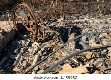 The Consequences Of A Fire In An Old Wooden Country House. Ashes And Burnt Boards Close-up. A Fire In A Residential Wooden House Due To Arson Of Dry Grass.