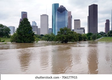 The consequences of the spill Buffalo Bayou River in Houston. Flooded park on Downtown city background. Hurricane Harvey - Shutterstock ID 706177915