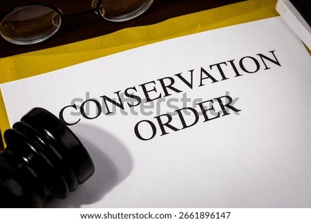 Conservation Order Document Set on Wooden Desk – Legal Mandate for Natural Resource Protection

