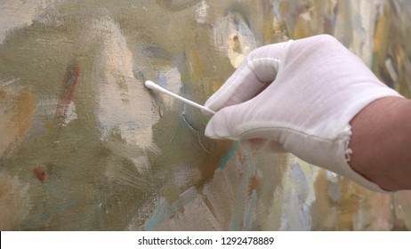 The Conservation And Restoration Of Painting Is Carried Out By Professional Painting Conservator