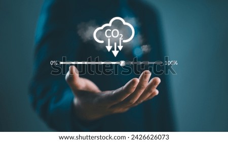 conservationist hold reduction carbon icon with cloud sky and loading bar for zero carbon emission from Kyoto protocol, carbon credit footprint to prevent climate change and global warming concept.