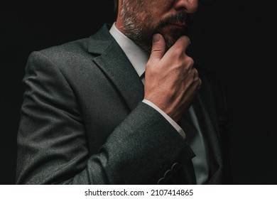 Consideration Before Starting A Business, Elegant Businessman In Gray Suit Thinking And Planning, Low Key Portrait With Selective Focus