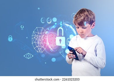 Considered handsome kid in casual wear standing holding smartphone near digital interface with padlock, finger print and globe in background. Concept of cybersecurity, futuristic technology, network
