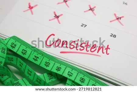 Consistent text on calendar with measuring tape. Concept of health persistence, fitness and diet tracking.