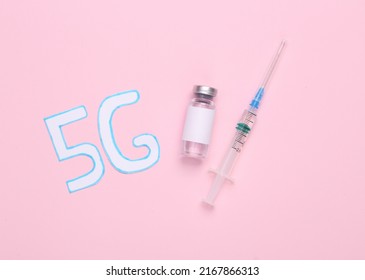 Conspiracy Theory. 5G Word And Vaccine Bottle With Syringe On Pink Background