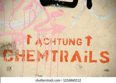 The Conspiracy Theory: Attention Chemtrails Sprayed On A Wall.

