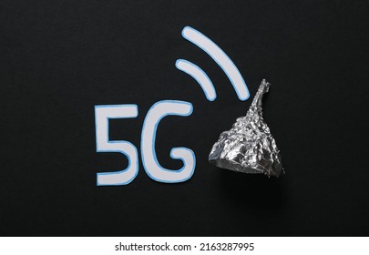 Conspiracy Theory. Foil Hat And Word 5G On A Black Background