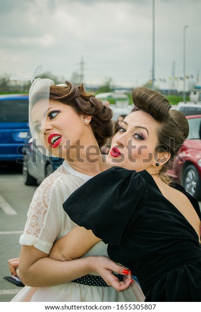 Constanta, Romania. 12-April-2014. Spring\
meeting of classic car owners,called Retroparada Primaverii, with\
beautiful girls dressed in retro\
outfits.