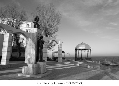 CONSTANTA, ROMANIA - DECEMBER 12, 2014. Winter day on the seafront at the Black Sea in Constanta,Romania .View of the Statue of Mihai Eminescu, great romanian writer, executed by sculptor Oscar Han . - Shutterstock ID 239752279
