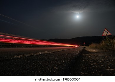 Constantine Algeria, High Way Light Trails At Full Moon Next To Corner Traffic Sign