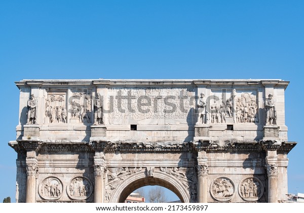 Constantine arch in\
Rome high section against\
sky