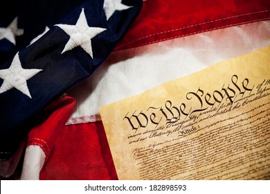 Constitution: USA Constitution Document with American Flag Behind - Shutterstock ID 182898593