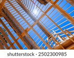 Construct wooden roof beams using trusses frames, rafters, joists