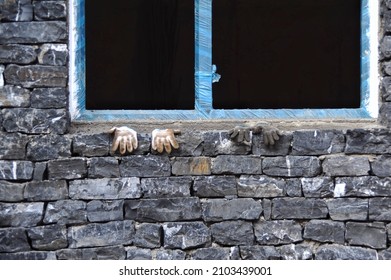 Constructing building with two pairs of gloves on the window in Hangzhou China
