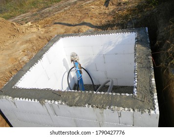 Constructing A Pump House, Pumping Station, Water Borehole Chamber From Insulating Concrete Forms ICF, Concrete Walls Between Polystyrene Foam Insulation.